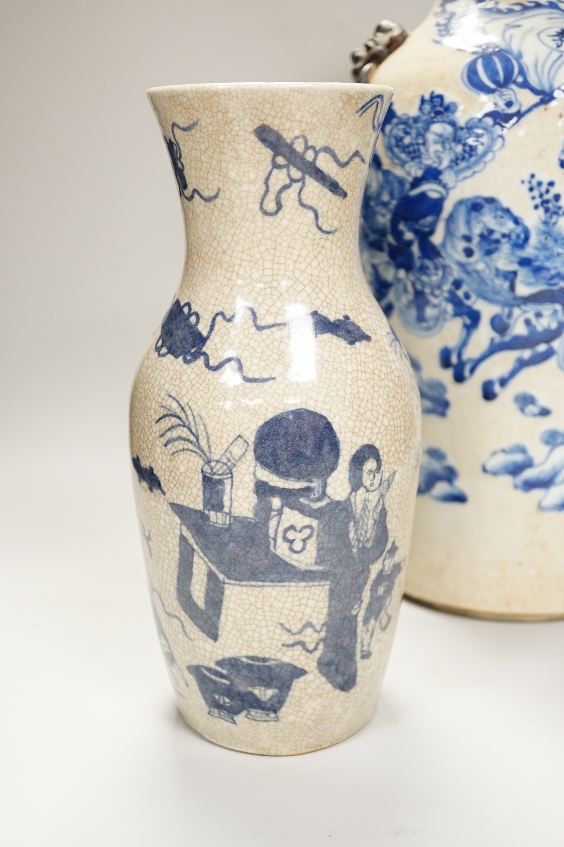 An early 20th century Chinese crackle glaze blue and white vase, 44cm and a later smaller vase